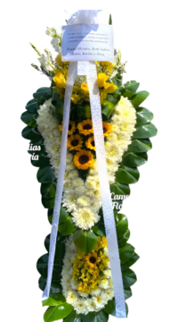 Cruz fúnebre con girasoles y rosas