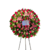 Corona fúnebre modelo picarón con rosas fucsias