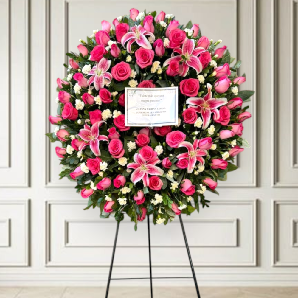 Corona fúnebre modelo picarón con rosas fucsias