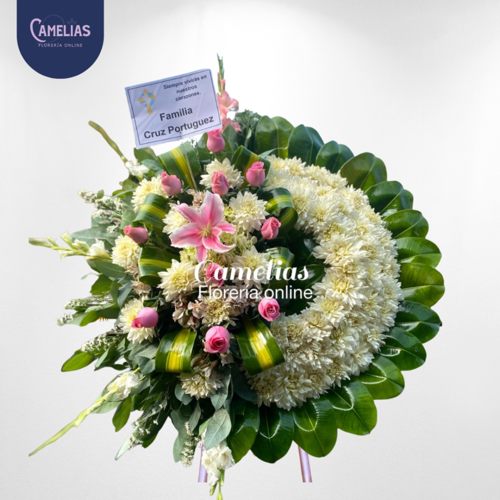 Corona funebre con rosas rosadas "Alas de luz"